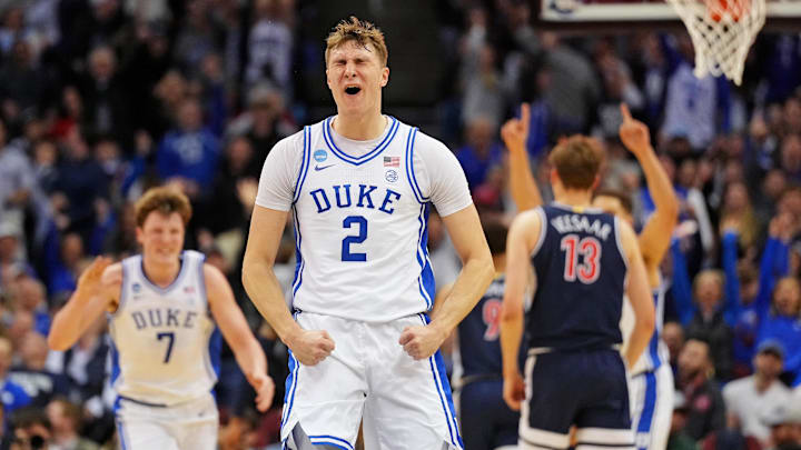 Mar 27, 2025; Newark, NJ, USA; Duke Blue Devils forward Cooper Flagg (2) reacts after making a last second shot to end the first half against the Arizona Wildcats during an East Regional semifinal of the 2025 NCAA tournament at Prudential Center. Mandatory Credit: Robert Deutsch-Imagn Images Mar 27, 2025; Newark, NJ, USA; Duke Blue Devils forward Cooper Flagg (2) reacts after making a last second shot to end the first half against the Arizona Wildcats during an East Regional semifinal of the 2025 NCAA tournament at Prudential Center. Mandatory Credit: Robert Deutsch-Imagn Images