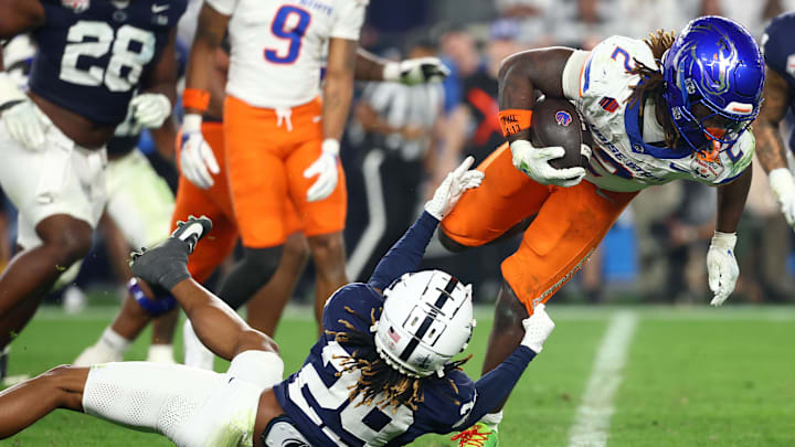 Dec 31, 2024; Glendale, AZ, USA; Boise State Broncos running back Ashton Jeanty (2) rushes the ball against the Penn State Nittany Lions during the second half in the Fiesta Bowl at State Farm Stadium. Mandatory Credit: Mark J. Rebilas-Imagn Images
