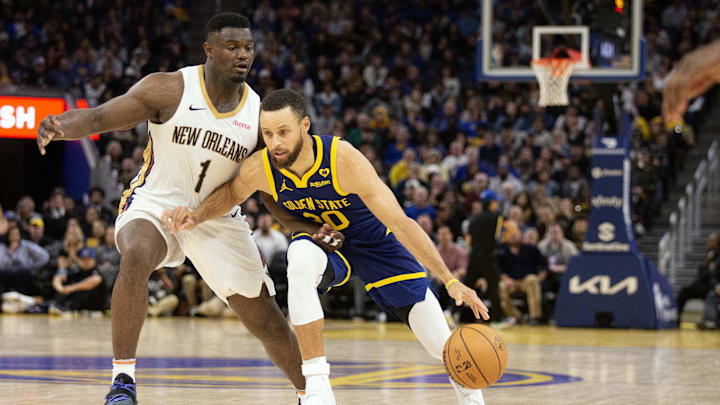  Golden State Warriors guard Stephen Curry (30) dribbles around New Orleans Pelicans forward Zion Williamson (1) during the fourth quarter at Chase Center. Mandatory Credit: D. Ross Cameron-Imagn Images