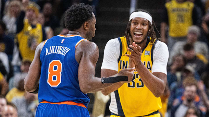 Nov 10, 2024; Indianapolis, Indiana, USA; Indiana Pacers center Myles Turner (33) celebrates a call in front of New York Knicks forward OG Anunoby (8) in the second half at Gainbridge Fieldhouse. Mandatory Credit: Trevor Ruszkowski-Imagn Images
