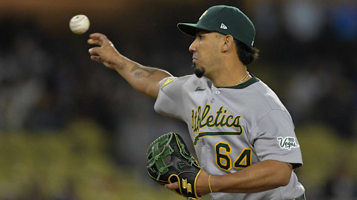 May 15, 2025; Los Angeles, California, USA; Athletics catcher Jhonny Pereda (64) pitches in the eighth inning against the Los Angeles Dodgers at Dodger Stadium. Mandatory Credit: Jayne Kamin-Oncea-Imagn Images May 15, 2025; Los Angeles, California, USA; Athletics catcher Jhonny Pereda (64) pitches in the eighth inning against the Los Angeles Dodgers at Dodger Stadium. Mandatory Credit: Jayne Kamin-Oncea-Imagn Images