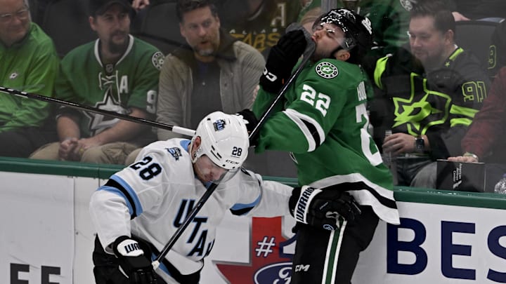 Apr 12, 2025; Dallas, Texas, USA; Dallas Stars center Mavrik Bourque (22) reacts after he is hit by the high stick of Utah Hockey Club defenseman Ian Cole (28) during the first period at the American Airlines Center. Mandatory Credit: Jerome Miron-Imagn Images