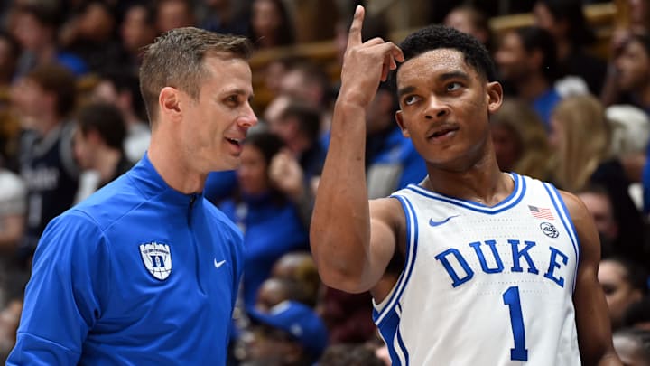 Duke Blue Devils guard Caleb Foster (1) gestures to head coach Jon Scheyer