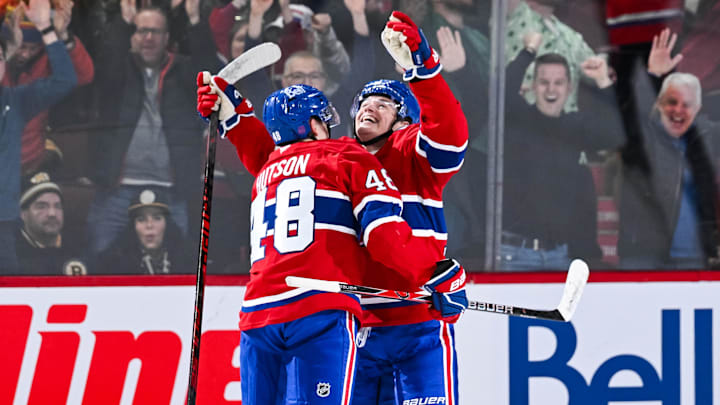 Mar 17, 2026; Montreal, Quebec, CAN; Montreal Canadiens right wing Cole Caufield (13) celebrates his game winning goal in overtime with defenseman Lane Hutson (48) against the Boston Bruins at Bell Centre. Mandatory Credit: David Kirouac-Imagn Images