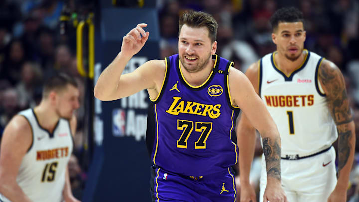 Feb 22, 2025; Denver, Colorado, USA; Los Angeles Lakers guard Luka Doncic (77) celebrates after a basket during the first half against the Denver Nuggets at Ball Arena. Mandatory Credit: Christopher Hanewinckel-Imagn Images