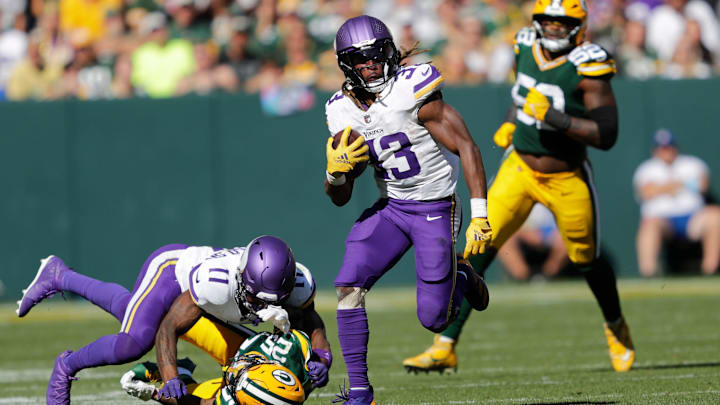 Minnesota Vikings running back Aaron Jones (33) runs for a gain against the Green Bay Packers during their football game Sunday, Sept. 29, 2024, at Lambeau Field in Green Bay, Wis. Minnesota Vikings running back Aaron Jones (33) runs for a gain against the Green Bay Packers during their football game Sunday, Sept. 29, 2024, at Lambeau Field in Green Bay, Wis.