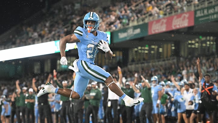 Tulane Green Wave running back Mekhi Hughes (21) runs with the ball.