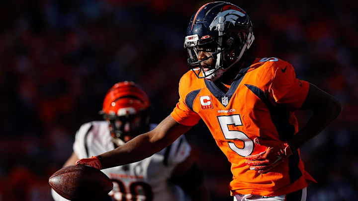 Dec 19, 2021; Denver, Colorado, USA; Denver Broncos quarterback Teddy Bridgewater (5) looks to hand off the ball in the second quarter against the Cincinnati Bengals at Empower Field at Mile High. Mandatory Credit: Isaiah J. Downing-Imagn Images