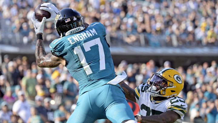 Oct 27, 2024; Jacksonville, Florida, USA; Jacksonville Jaguars tight end Evan Engram (17) catches a touchdown pass during the fourth quarter against the Green Bay Packers at EverBank Stadium. 