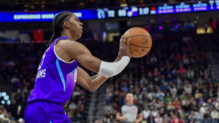 Mar 19, 2025; Salt Lake City, Utah, USA;  Utah Jazz forward Cody Williams (5) makes three point attempt against the Washington Wizards during the second half at the Delta Center. Mandatory Credit: Peter Creveling-Imagn Images