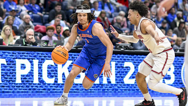 Florida Gators guard Walter Clayton Jr. (1) drives baseline.