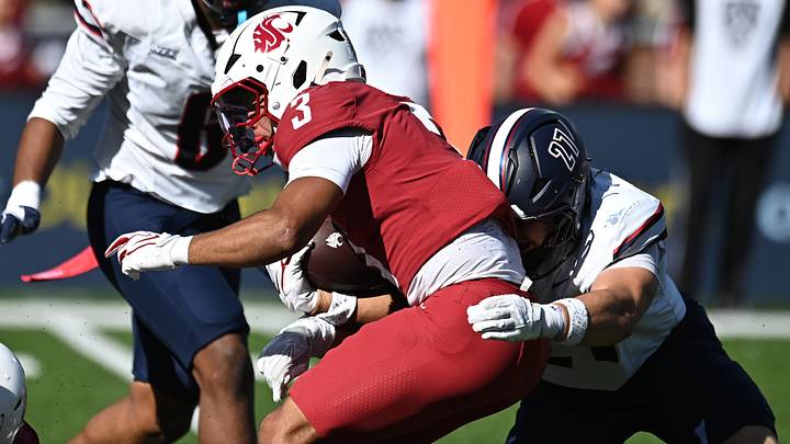 Washington State Cougars running back Maxwell Woods (3) is tackled by Duquesne Dukes defensive lineman Nico Pate (27) during the second half at Gesa Field at Martin Stadium. Washington State Cougars running back Maxwell Woods (3) is tackled by Duquesne Dukes defensive lineman Nico Pate (27) during the second half at Gesa Field at Martin Stadium.
