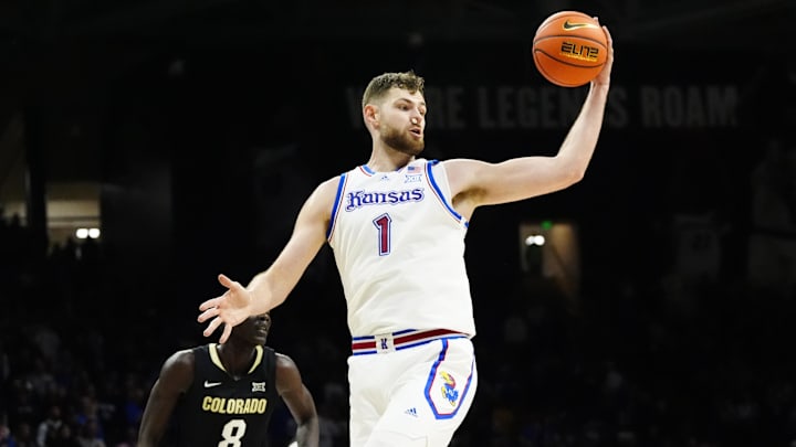 Feb 24, 2025; Boulder, Colorado, USA; Kansas Jayhawks center Hunter Dickinson (1) pulls in a rebound in the second half against the Colorado Buffaloes at the CU Events Center. Mandatory Credit: Ron Chenoy-Imagn Images