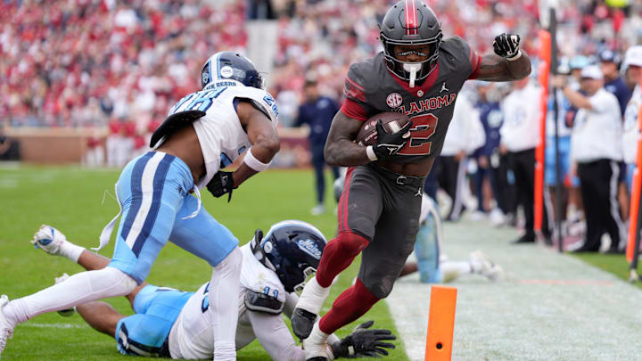 Oklahoma Sooners running back Jovantae Barnes scores against the Maine Black Bears.