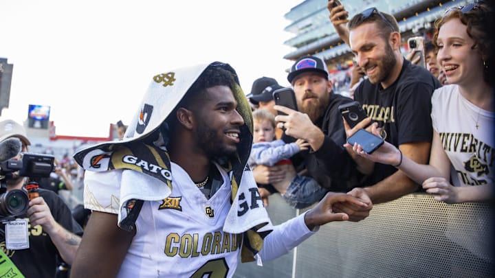 Oct 19, 2024; Tucson, Arizona, USA; Colorado Buffalos quarterback Shedeur Sanders (2) greets fans after defeating the Arizona Wildcats at Arizona Stadium. Mandatory Credit: Mark J. Rebilas-Imagn Images