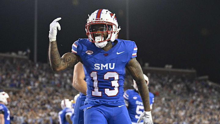 Nov 2, 2024; Dallas, Texas, USA; Southern Methodist Mustangs wide receiver Roderick Daniels Jr. (13) celebrates scoring a touchdown against the Pittsburgh Panthers during the first half at Gerald J. Ford Stadium. Nov 2, 2024; Dallas, Texas, USA; Southern Methodist Mustangs wide receiver Roderick Daniels Jr. (13) celebrates scoring a touchdown against the Pittsburgh Panthers during the first half at Gerald J. Ford Stadium.