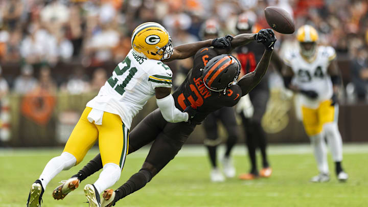 Sep 21, 2025; Cleveland, Ohio, USA; Green Bay Packers cornerback Nate Hobbs (21) breaks up a pass as Cleveland Browns wide receiver Jerry Jeudy (3) dives for the ball during the fourth quarter at Huntington Bank Field. Mandatory Credit: Scott Galvin-Imagn Images
