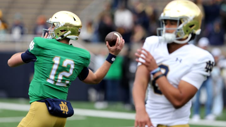 Notre Dame quarterbacks CJ Carr (12) and Kenny Minchey (8) warm up Saturday, April 20, 2024, at the annual Notre Dame Blue-Gold spring football game at Notre Dame Stadium in South Bend.
