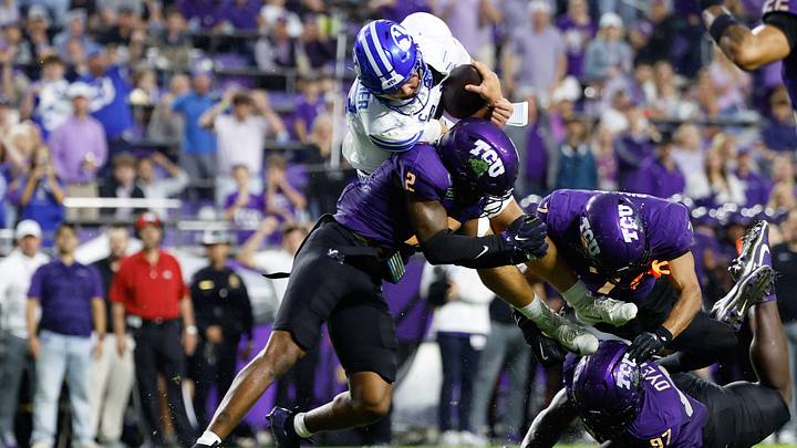 Oct 3, 2026; Fort Worth, Texas, USA;  BYU Cougars quarterback Bear Bachmeier (47) scores a touchdown as TCU Horned Frogs safety Jamel Johnson (2) defends during the first half at Amon G. Carter Stadium.  Mandatory Credit: Chris Jones-Imagn Images