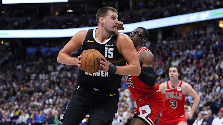 Nov 17, 2025; Denver, Colorado, USA; Chicago Bulls forward/center Jalen Smith (25) defends on Denver Nuggets center Nikola J Nov 17, 2025; Denver, Colorado, USA; Chicago Bulls forward/center Jalen Smith (25) defends on Denver Nuggets center Nikola J