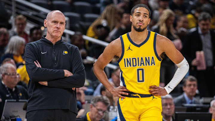 Oct 30, 2023; Indianapolis, Indiana, USA; Indiana Pacers head coach Rick Carlisle and guard Tyrese Haliburton (0) look on in the second half against the Chicago Bulls at Gainbridge Fieldhouse. Mandatory Credit: Trevor Ruszkowski-USA TODAY Sports
