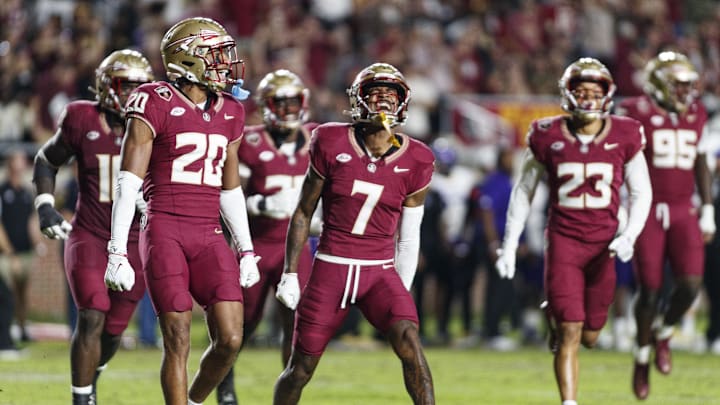 Nov 18, 2023; Tallahassee, Florida, USA; Florida State Seminoles defensive back Azareye'h Thomas (20) and defensive back Jarrian Jones (7) celebrate an interception against the North Alabama Lions during the third quarter at Doak S. Campbell Stadium. Mandatory Credit: Morgan Tencza-Imagn Images