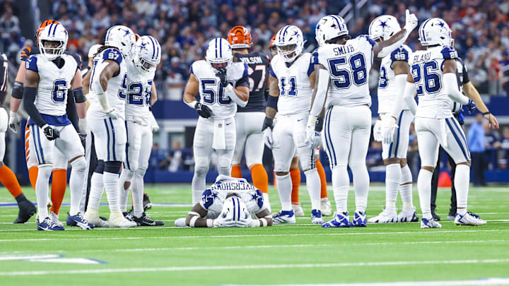 Dec 9, 2024; Arlington, Texas, USA; Dallas Cowboys linebacker DeMarvion Overshown (13) lays injured around teammates during the second half against the Cincinnati Bengals at AT&T Stadium. Mandatory Credit: Kevin Jairaj-Imagn Images Dec 9, 2024; Arlington, Texas, USA; Dallas Cowboys linebacker DeMarvion Overshown (13) lays injured around teammates during the second half against the Cincinnati Bengals at AT&T Stadium. Mandatory Credit: Kevin Jairaj-Imagn Images