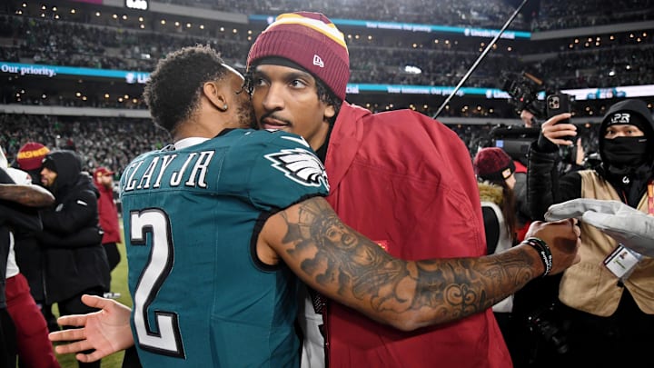 Jan 26, 2025; Philadelphia, PA, USA; Philadelphia Eagles cornerback Darius Slay Jr. (2) hugs Washington Commanders quarterback Jayden Daniels (5) after the NFC Championship game at Lincoln Financial Field. 
