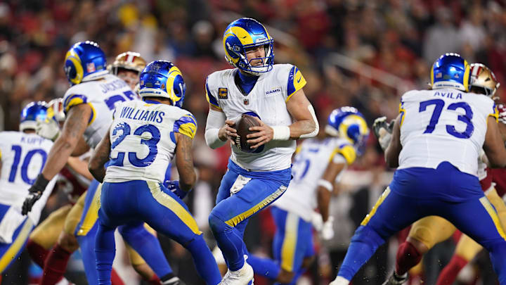 Dec 12, 2024; Santa Clara, California, USA; Los Angeles Rams quarterback Matthew Stafford (9) holds onto the ball against the San Francisco 49ers in the fourth quarter at Levi's Stadium. Mandatory Credit: Cary Edmondson-Imagn Images Dec 12, 2024; Santa Clara, California, USA; Los Angeles Rams quarterback Matthew Stafford (9) holds onto the ball against the San Francisco 49ers in the fourth quarter at Levi's Stadium. Mandatory Credit: Cary Edmondson-Imagn Images