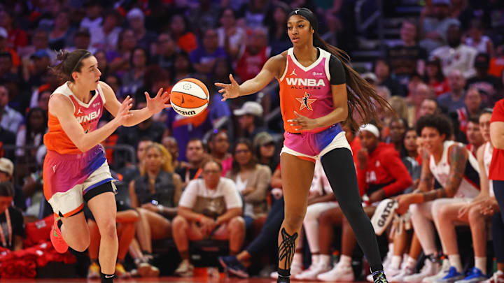Jul 20, 2024; Phoenix, AZ, USA; Team WNBA forward Angel Reese (5) passes the ball to Team WNBA guard Caitlin Clark (22) during the first half against the USA Women's National Team at Footprint Center. Mandatory Credit: Mark J. Rebilas-USA TODAY Sports