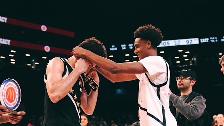 Alijah Arenas (right) puts the 2025 McDonald's All-American game MVP necklace around Cameron Boozer.
