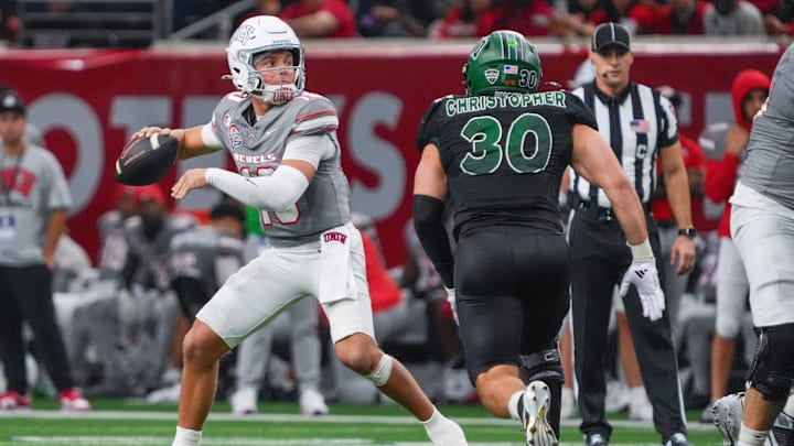 UNLV quarterback Anthony Colandrea stands in the pocket as Ohio linebacker Charlie Christopher defends during the second half of the Frisco Bowl. 
