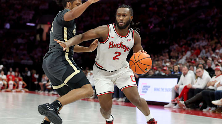Mar 1, 2026; Columbus, Ohio, USA; Ohio State Buckeyes guard Bruce Thornton (2)  controls the ball as Purdue Boilermakers guard Gicarri Harris (24) defends during the second half at Value City Arena. Mandatory Credit: Joseph Maiorana-Imagn Images