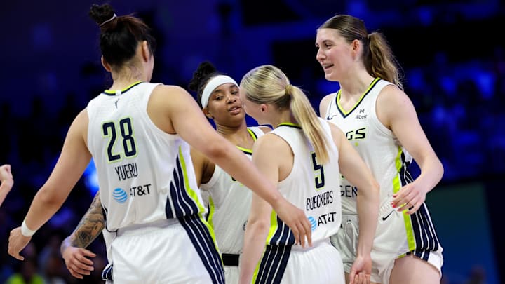 Jul 3, 2025; Arlington, Texas, USA; Dallas Wings guard Paige Bueckers (5) celebrates with Dallas Wings center Luisa Geiselsoder (18) and Dallas Wings center Li Yueru (28) and Dallas Wings guard Aziaha James (10) against the Phoenix Mercury during the first half at College Park Center. Mandatory Credit: Kevin Jairaj-Imagn Images Jul 3, 2025; Arlington, Texas, USA; Dallas Wings guard Paige Bueckers (5) celebrates with Dallas Wings center Luisa Geiselsoder (18) and Dallas Wings center Li Yueru (28) and Dallas Wings guard Aziaha James (10) against the Phoenix Mercury during the first half at College Park Center. Mandatory Credit: Kevin Jairaj-Imagn Images