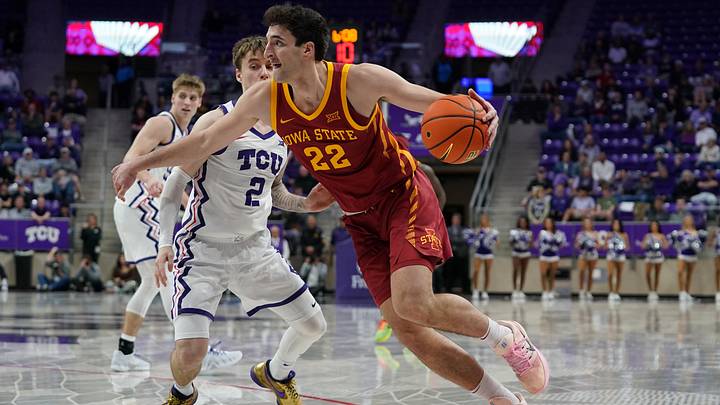 Feb 10, 2026; Fort Worth, Texas, USA; Iowa State Cyclones forward Milan Momcilovic (22) drives on TCU Horned Frogs guard Brock Harding (2) during the second half at Ed and Rae Schollmaier Arena. Feb 10, 2026; Fort Worth, Texas, USA; Iowa State Cyclones forward Milan Momcilovic (22) drives on TCU Horned Frogs guard Brock Harding (2) during the second half at Ed and Rae Schollmaier Arena.