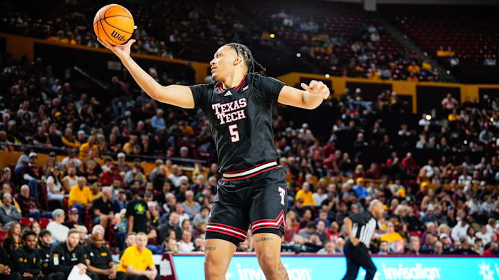 Mar 8, 2025; Tempe, Arizona, USA; Texas Tech Red Raiders forward Darrion Williams (5) rebounds the ball against the Arizona State Sun Devils at Desert Financial Arena. Mandatory Credit: Arianna Grainey-Imagn Images