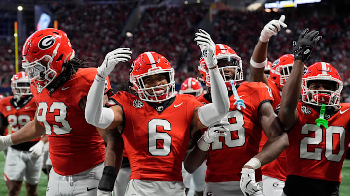 Georgia defensive back Daylen Everette (6) celebrates with his teammates after picking off a pass from Texas quarterback Quinn Ewers (3) during the second half of the SEC championship game against Texas in Atlanta, on Saturday, Dec. 7, 2024. Georgia defensive back Daylen Everette (6) celebrates with his teammates after picking off a pass from Texas quarterback Quinn Ewers (3) during the second half of the SEC championship game against Texas in Atlanta, on Saturday, Dec. 7, 2024.