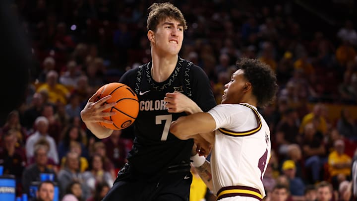 Jan 3, 2026; Tempe, Arizona, USA; Colorado Buffaloes forward Sebastian Rancik (7) controls the ball against Arizona State Sun Devils guard Bryce Ford (4) in the first half at Desert Financial Arena. Mandatory Credit: Mark J. Rebilas-Imagn Images
