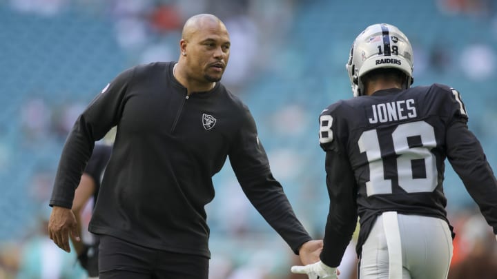 Nov 19, 2023; Miami Gardens, Florida, USA; Las Vegas Raiders interim head coach Antonio Pierce high-fives Las Vegas Raiders cornerback Jack Jones prior to the game against the Miami Dolphins at Hard Rock Stadium. Mandatory Credit: Sam Navarro-USA TODAY Sports