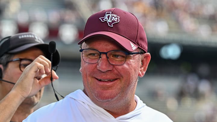 Oct 5, 2024; College Station, Texas, USA; Texas A&M Aggies head coach Mike Elko gets ready for a pre-game interview with the SEC Nation prior to the game against the Missouri Tigers at Kyle Field. Mandatory Credit: Maria Lysaker-Imagn Images. 