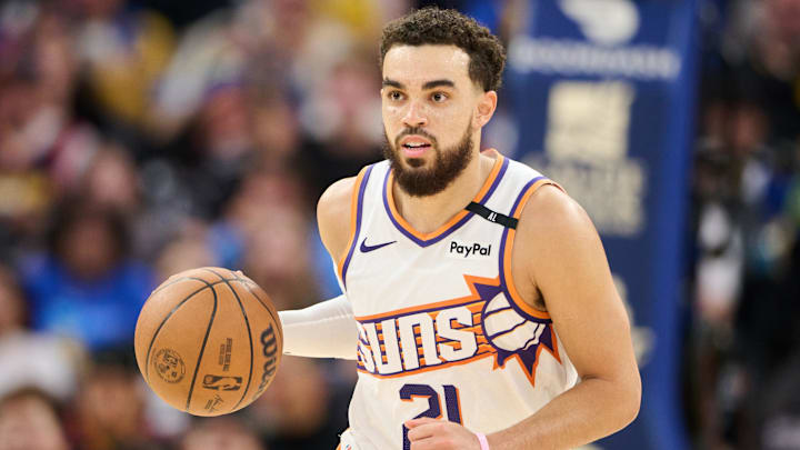 Dec 28, 2024; San Francisco, California, USA; Phoenix Suns guard Tyus Jones (21) dribbles the ball against the Golden State Warriors during the third quarter at Chase Center. Mandatory Credit: Robert Edwards-Imagn Images