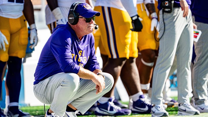 LSU head coach Brian Kelly crouches on the sidelines during a college football game between Ole Miss and LSU at Vaught-Hemingway Stadium in Oxford, Miss., on Saturday, Sept. 27, 2025.