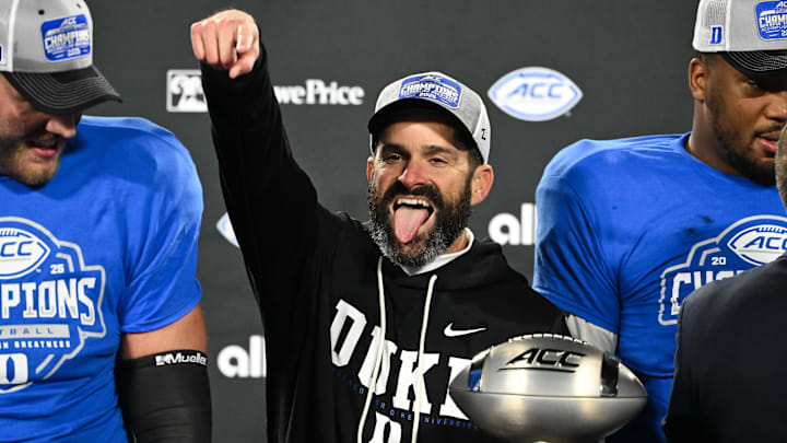 Dec 6, 2025; Charlotte, NC, USA; Duke Blue Devils head coach Manny Diaz celebrates defeating the Virginia Cavaliers at the 2025 ACC Championship game at Bank of America Stadium. Mandatory Credit: Bob Donnan-Imagn Images Dec 6, 2025; Charlotte, NC, USA; Duke Blue Devils head coach Manny Diaz celebrates defeating the Virginia Cavaliers at the 2025 ACC Championship game at Bank of America Stadium. Mandatory Credit: Bob Donnan-Imagn Images