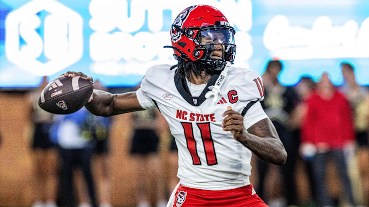 Sep 11, 2025; Winston-Salem, North Carolina, USA; North Carolina State Wolfpack quarterback CJ Bailey (11) throws a pass in first half against Wake Forest Demon Deacons at Allegacy Federal Credit Union Stadium. Mandatory Credit: Luke Jamroz-Imagn Images