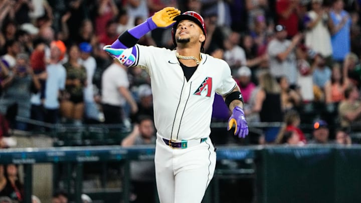 Jun 28, 2025; Phoenix, Arizona, USA; Arizona Diamondbacks second baseman Ketel Marte (4) reacts at home plate after hitting a three-run home run in the fourth inning against the Miami Marlins at Chase Field. Mandatory Credit: Arianna Grainey-Imagn Images