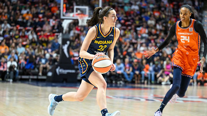 Sep 22, 2024; Uncasville, Connecticut, USA; Indiana Fever guard Caitlin Clark (22) dribbles the ball chased by Connecticut Sun forward DeWanna Bonner (24) in the first quarterduring game one of the first round of the 2024 WNBA Playoffs at Mohegan Sun Arena. Mandatory Credit: Mark Smith-Imagn Images Sep 22, 2024; Uncasville, Connecticut, USA; Indiana Fever guard Caitlin Clark (22) dribbles the ball chased by Connecticut Sun forward DeWanna Bonner (24) in the first quarterduring game one of the first round of the 2024 WNBA Playoffs at Mohegan Sun Arena. Mandatory Credit: Mark Smith-Imagn Images