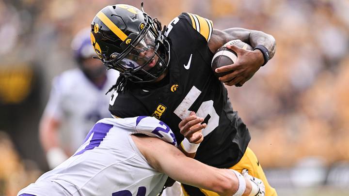Sep 19, 2026; Iowa City, Iowa, USA; Iowa Hawkeyes running back Nathan McNeil (5) runs for a touchdown as UNI Panthers safety Calvin Jaworski (21) looks to make the tackle during the second quarter at Kinnick Stadium. Mandatory Credit: Jeffrey Becker-Imagn Images Sep 19, 2026; Iowa City, Iowa, USA; Iowa Hawkeyes running back Nathan McNeil (5) runs for a touchdown as UNI Panthers safety Calvin Jaworski (21) looks to make the tackle during the second quarter at Kinnick Stadium. Mandatory Credit: Jeffrey Becker-Imagn Images
