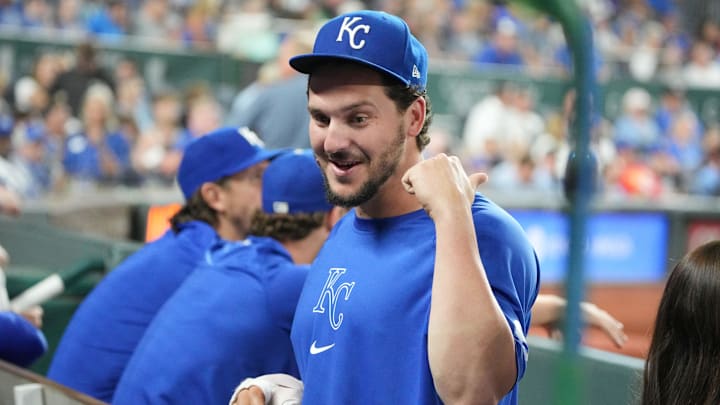 Sep 4, 2024; Kansas City, Missouri, USA; An injured Kansas City Royals first baseman Vinnie Pasquantino (9) talks with teammates against the Cleveland Guardians in the eighth inning at Kauffman Stadium.
