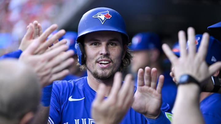 Jun 9, 2025; St. Louis, Missouri, USA;  Toronto Blue Jays third baseman Addison Barger (47) is congratulated by teammates after scoring against the St. Louis Cardinals during the first inning at Busch Stadium. Mandatory Credit: Jeff Curry-Imagn Images