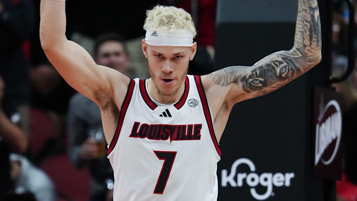 Louisville's Kasean Pryor (7) tries to get the crowd into the game after defensive stop against Morehead State during their game at the KFC Yum! Center in Louisville, Ky. on Nov. 4, 2024